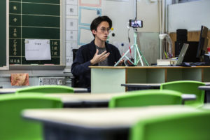 On 6 March 2020, primary school teacher Billy Yeung records a video lesson for his students who have had their classes suspended due to the COVID-19 coronavirus, in his empty classroom in Hong Kong.