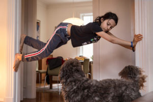 Sacha, 13 years old, climbs the walls on the 10th of April 2020, in our home in Montreal, Canada.