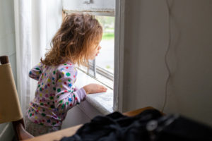 On 17 May 2020, Margot, 4, looks out the window in New York, United States of America. Along with more than 1 million other children and youth, Margot has been staying at home with her family since mid-March, with the city largely shut down as a preventative measure against the further spread of coronavirus (COVID-19).