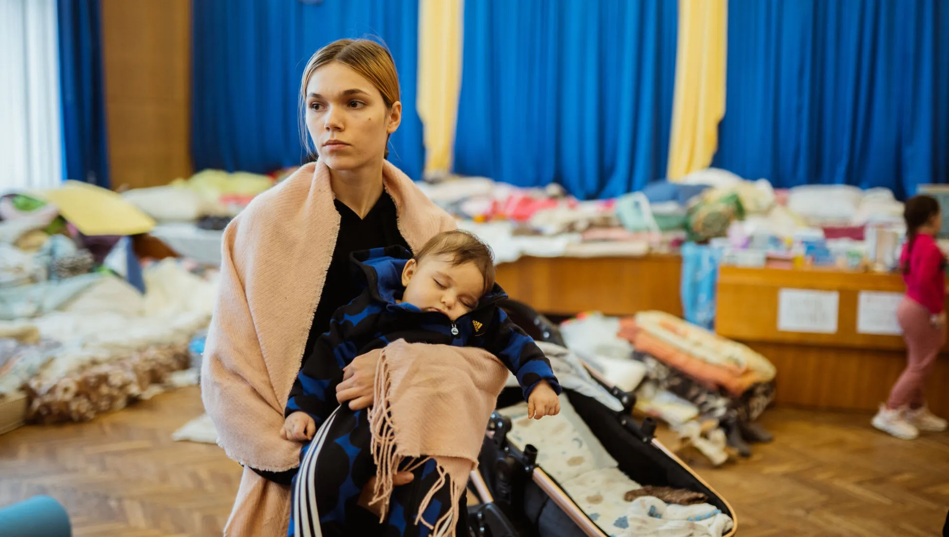 Mother holding her child in an air raid shelter in Lviv